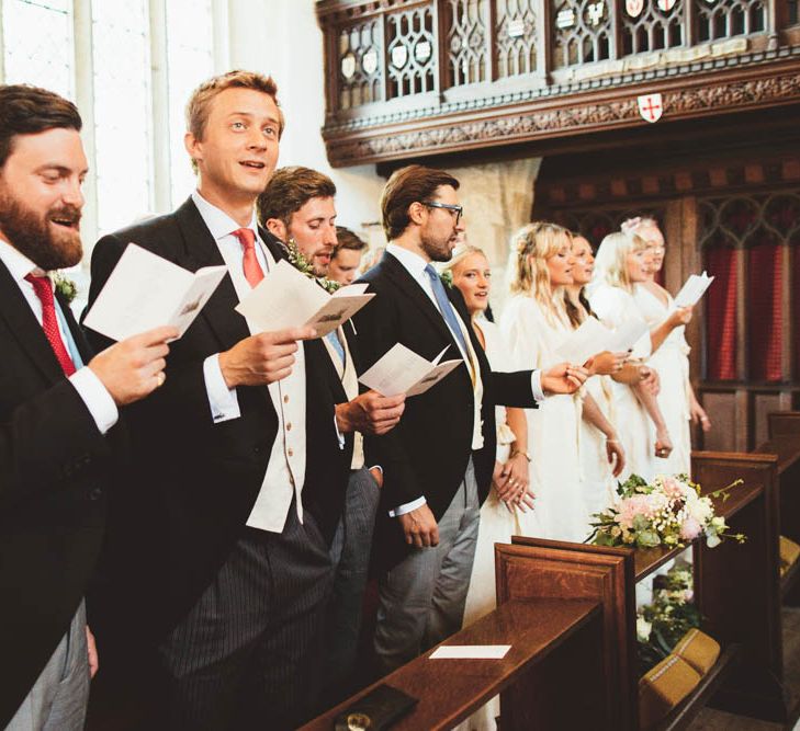 Groomsmen and Bridesmaids Singing During the Church Wedding Ceremony