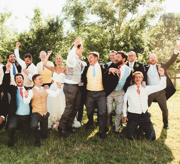 Bride in Halfpenny London Wedding Dress with Groomsmen in  Waistcoats and Tails