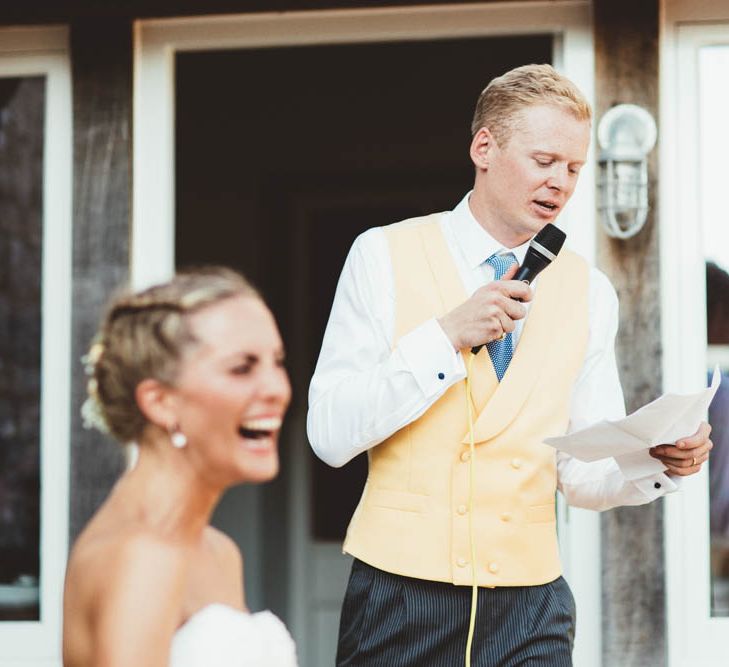 Groom in Yellow Waistcoat and Blue Tie Giving His Wedding Speech