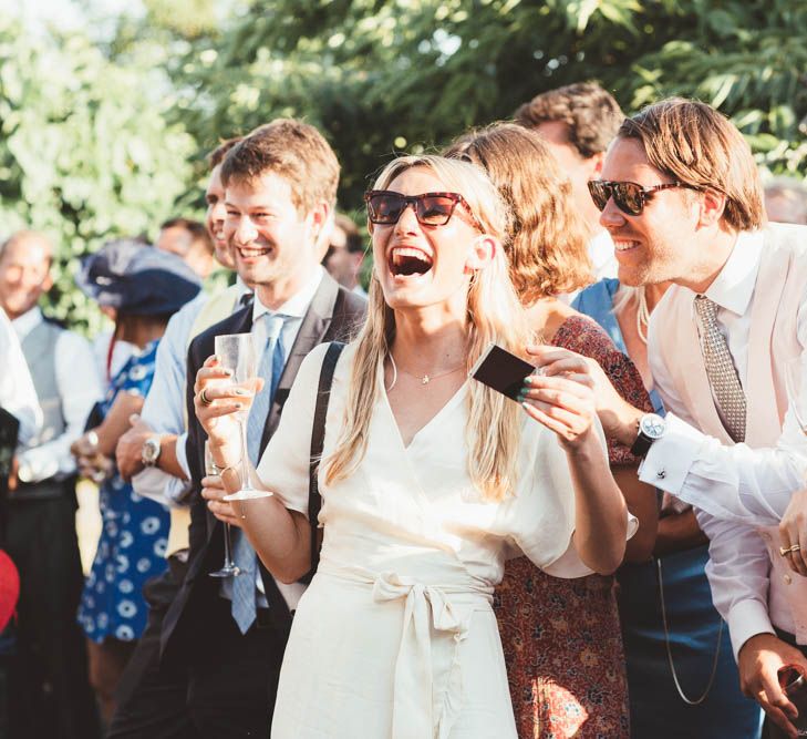 Wedding Guests Laughing During Wedding Speeches