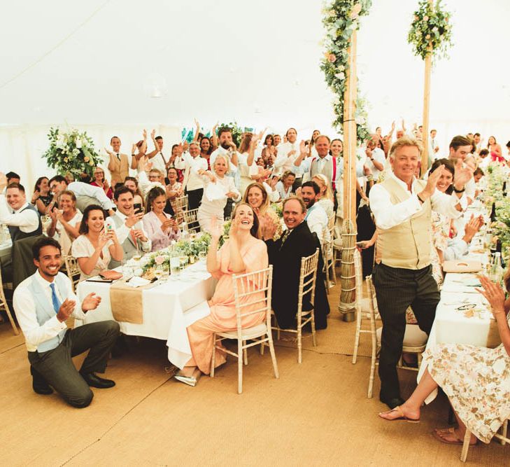 Wedding Guests Clapping in Marquee Wedding Reception