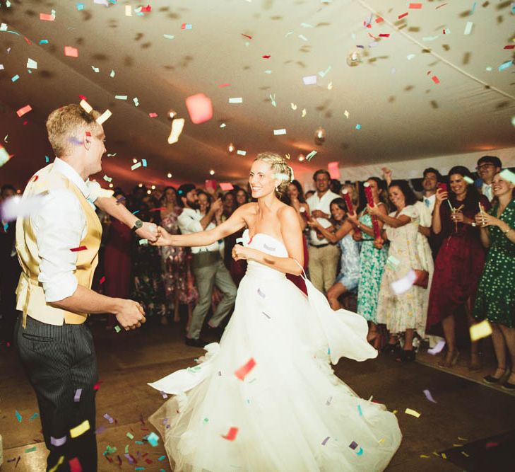 Confetti Bomb Dance Floor Moment with Bride in Halfpenny London Wedding Dress and Groom in Yellow Waistcoat