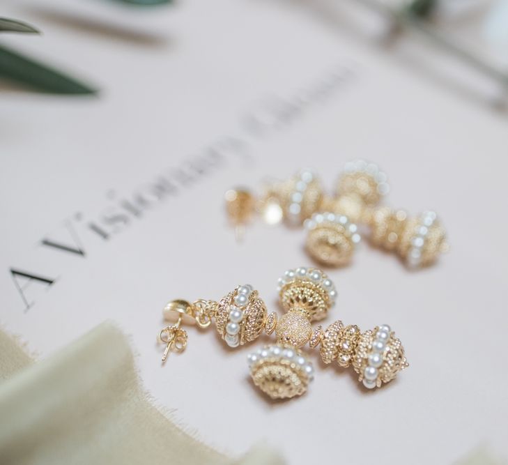 Gold and pearl crusafix earrings