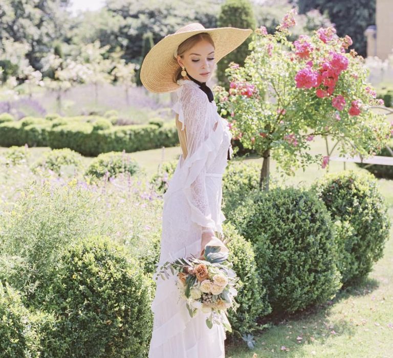 Bride in lace and ruffle wedding dress for Italian themed micro wedding at The Old Rectory Estate