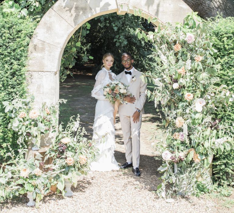 Italian themed micro wedding with bride in ruffle dress and groom in a beige suit