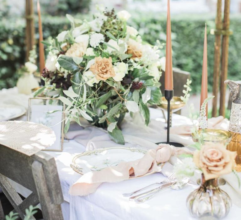 Italian themed micro wedding  tablescape  with candles and flowers