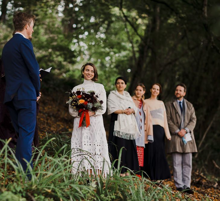 Boho Bride in Crochet Wedding Dress and Woollen Jumper  Saying I Do in a Woodland Forest