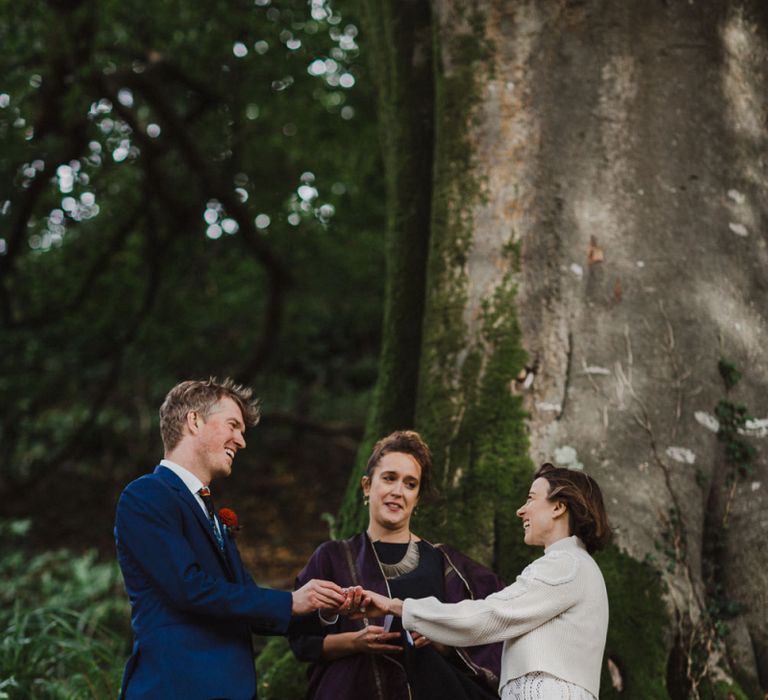 Bride and Groom Saying Their Vows During a Woodland Ceremony