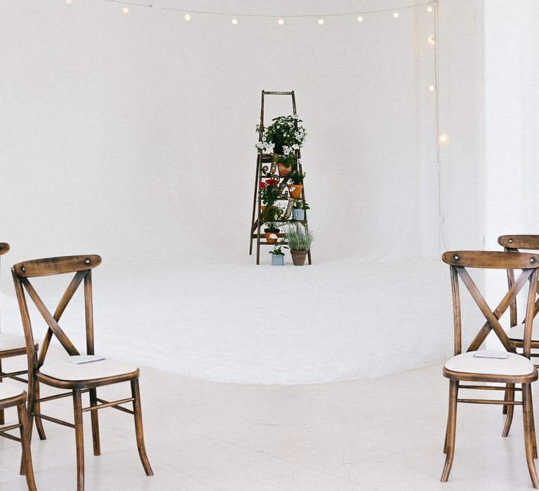 Wedding Ceremony Decor | Industrial Ladder with Potted Plants | Festoon Lights | Whitewashed Walls | Same Sex Wedding with Industrial Styling at Wimborne House | Marmelo Photography