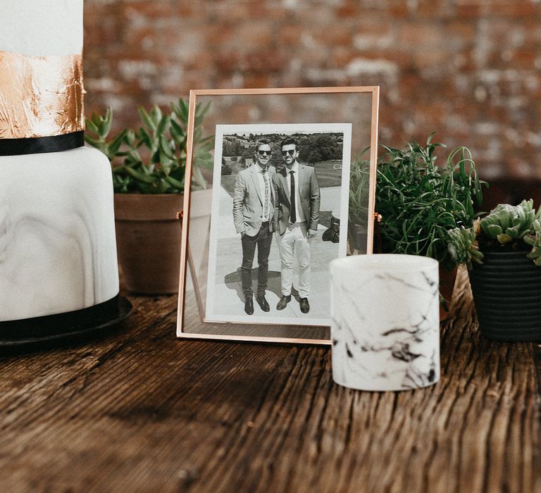 Wedding Reception Decor | Marble Wedding Cake with Copper Leaf | Photo in Copper Frame | Potted Plants | Succulents | Same Sex Wedding with Industrial Styling at Wimborne House | Marmelo Photography