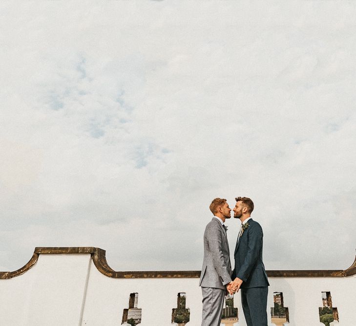 Groom in Dark Petrol Blue Suit by Paul Smith | Groom in Light Blue Made-To-Measure Suit by Beggars Run | Same Sex Wedding with Industrial Styling at Wimborne House | Marmelo Photography