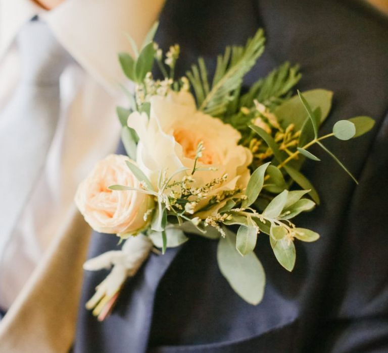 Large pink rose buttonhole fro groom