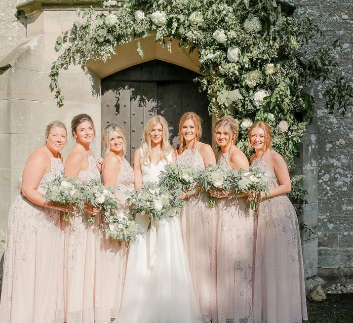 bridal party portrait with bridesmaids in pink dresses