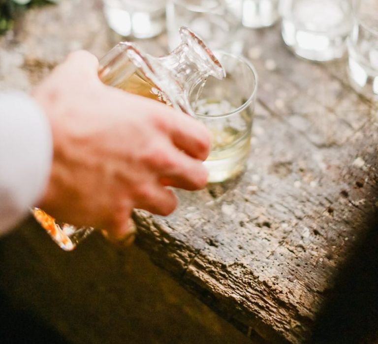 Groomsmen drinking whiskey on wedding morning