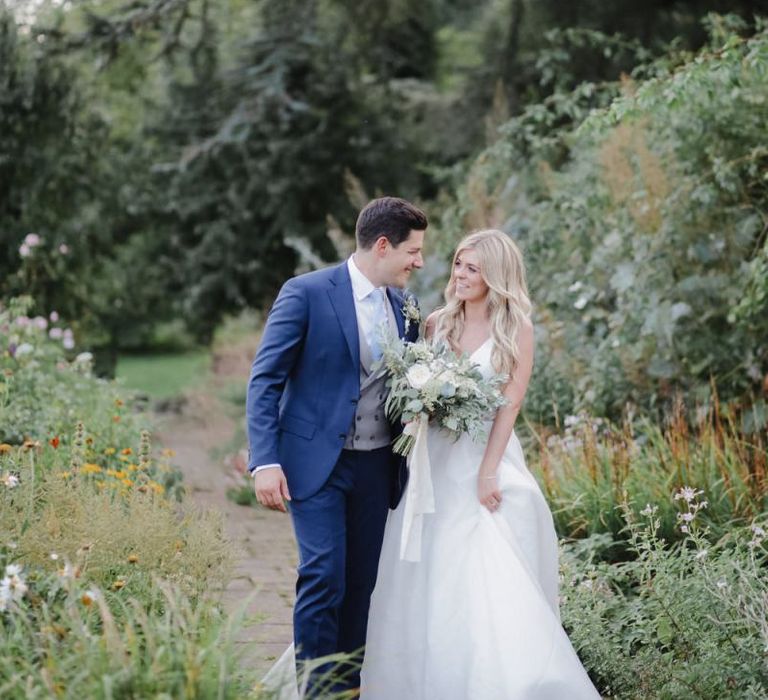 Bride and groom portrait in the gardens at Askham Hall