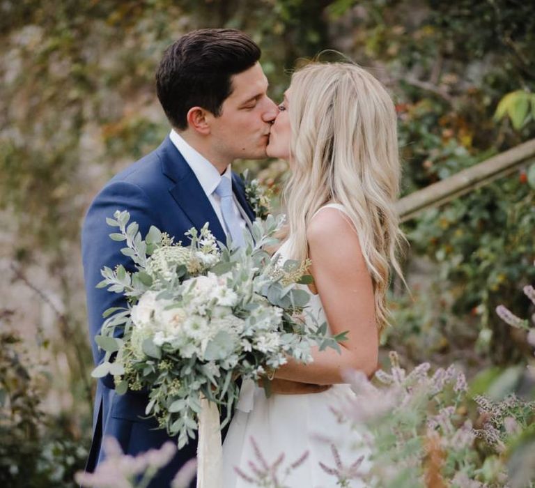 White bridal bouquet with foliage for Askham Hall wedding