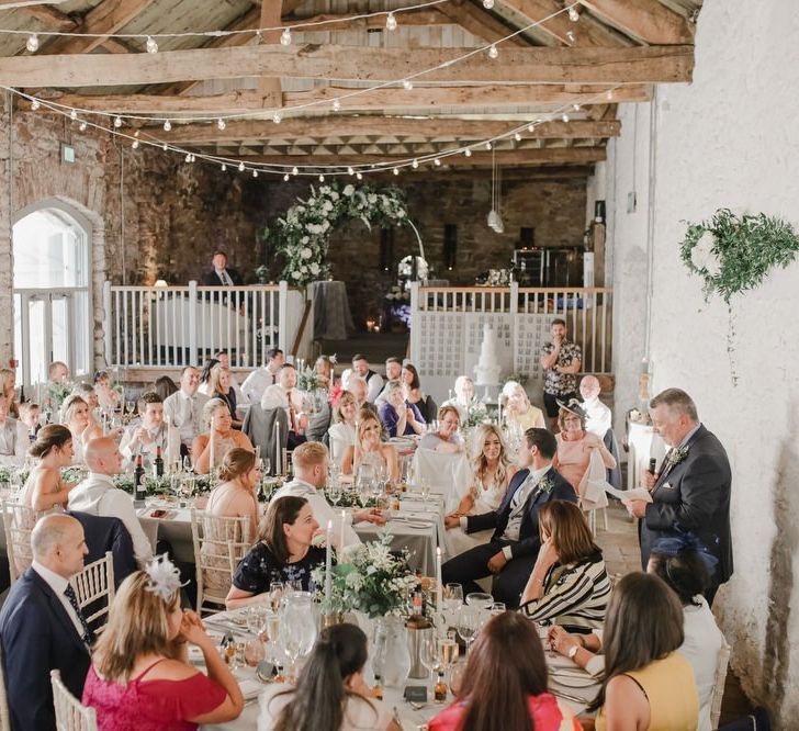 Wedding guests enjoying the wedding breakfast at Askham Hall