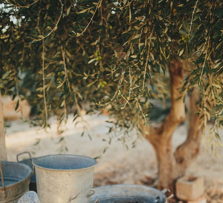 Watering Cans | Brightly Coloured Destination Wedding at Masseria Potenti Wedding Venue, Puglia, South Italy | Petar Jurica Photography | Marco Odorino Film