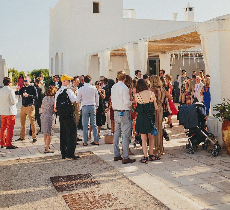 Wedding Guests | Brightly Coloured Destination Wedding at Masseria Potenti Wedding Venue, Puglia, South Italy | Petar Jurica Photography | Marco Odorino Film