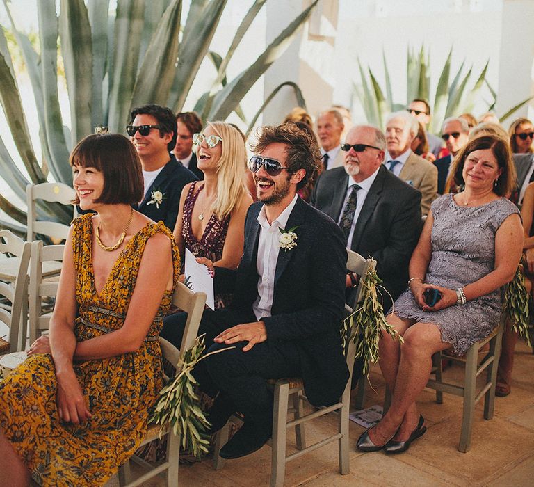 Outdoor Wedding Ceremony | Wedding Guests | Brightly Coloured Destination Wedding at Masseria Potenti Wedding Venue, Puglia, South Italy | Petar Jurica Photography | Marco Odorino Film