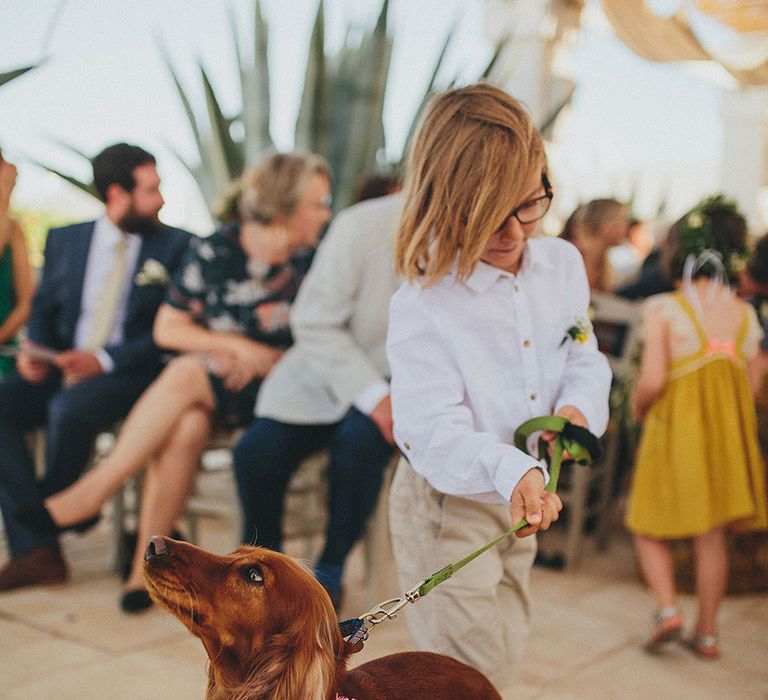 Outdoor Wedding Ceremony | Page Boy &amp; Pup | Brightly Coloured Destination Wedding at Masseria Potenti Wedding Venue, Puglia, South Italy | Petar Jurica Photography | Marco Odorino Film