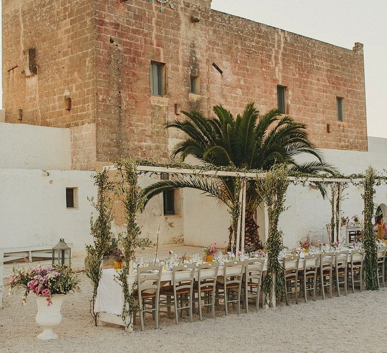 Outdoor Wedding Reception with Vines | Brightly Coloured Destination Wedding at Masseria Potenti Wedding Venue, Puglia, South Italy | Petar Jurica Photography | Marco Odorino Film