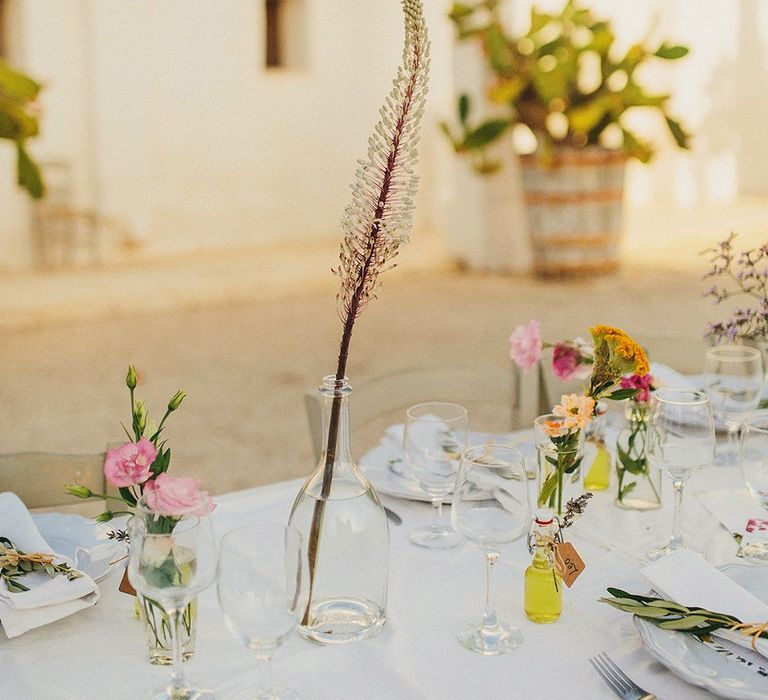 Wild Flower Stems in Vases | Wedding Decor | Brightly Coloured Destination Wedding at Masseria Potenti Wedding Venue, Puglia, South Italy | Petar Jurica Photography | Marco Odorino Film