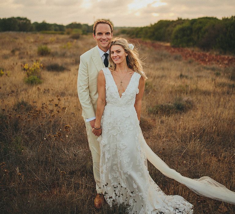 Bride in Custom Clemence Halfpenny London Bridal Gown | Groom in Cream Three Piece Suit | Brightly Coloured Destination Wedding at Masseria Potenti Wedding Venue, Puglia, South Italy | Petar Jurica Photography | Marco Odorino Film