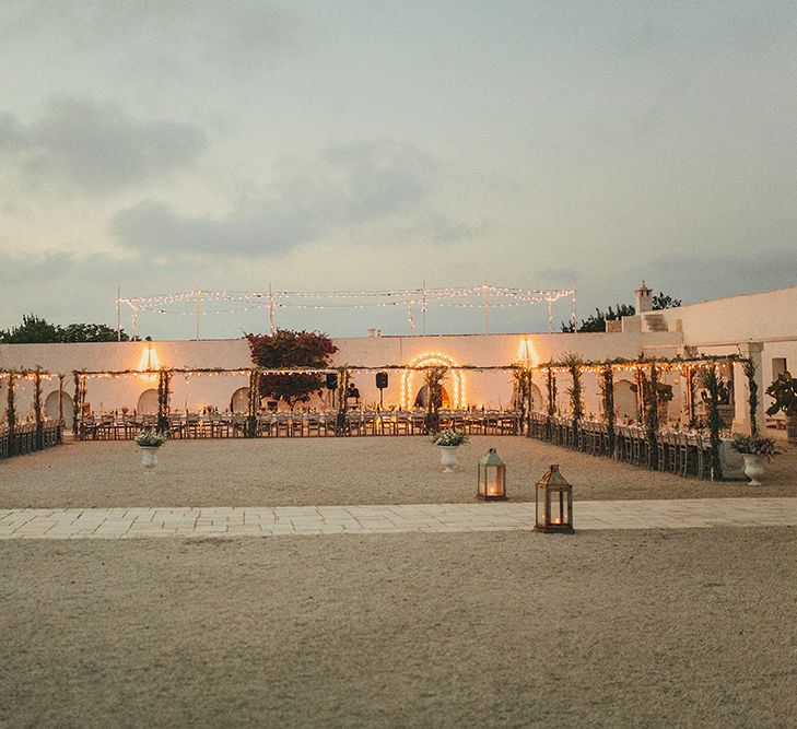 Outdoor Wedding Reception with Vines | Brightly Coloured Destination Wedding at Masseria Potenti Wedding Venue, Puglia, South Italy | Petar Jurica Photography | Marco Odorino Film