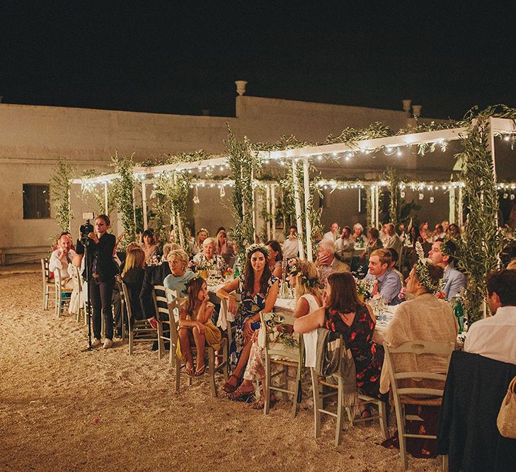 Outdoor Wedding Reception with Fairy Lights | Brightly Coloured Destination Wedding at Masseria Potenti Wedding Venue, Puglia, South Italy | Petar Jurica Photography | Marco Odorino Film