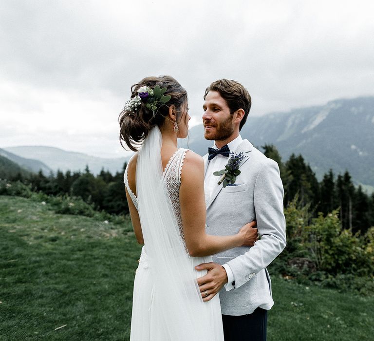 Bride in Mariées Passion Wedding Dress and Groom in Grey Blazer