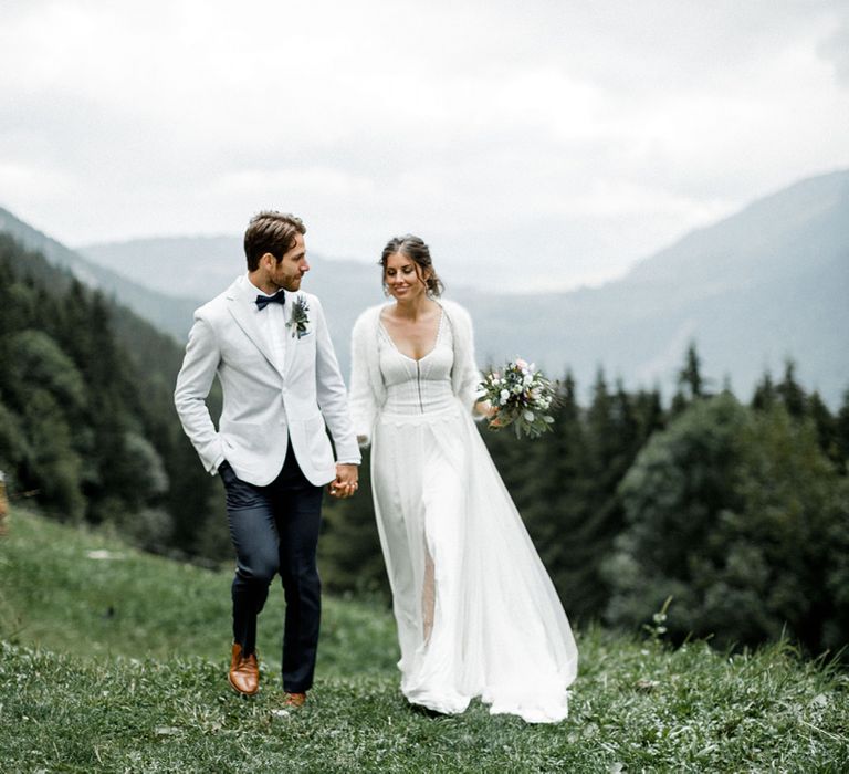 Bride in Mariées Passion Wedding Dress and Groom in Grey Blazer and Navy Chinos