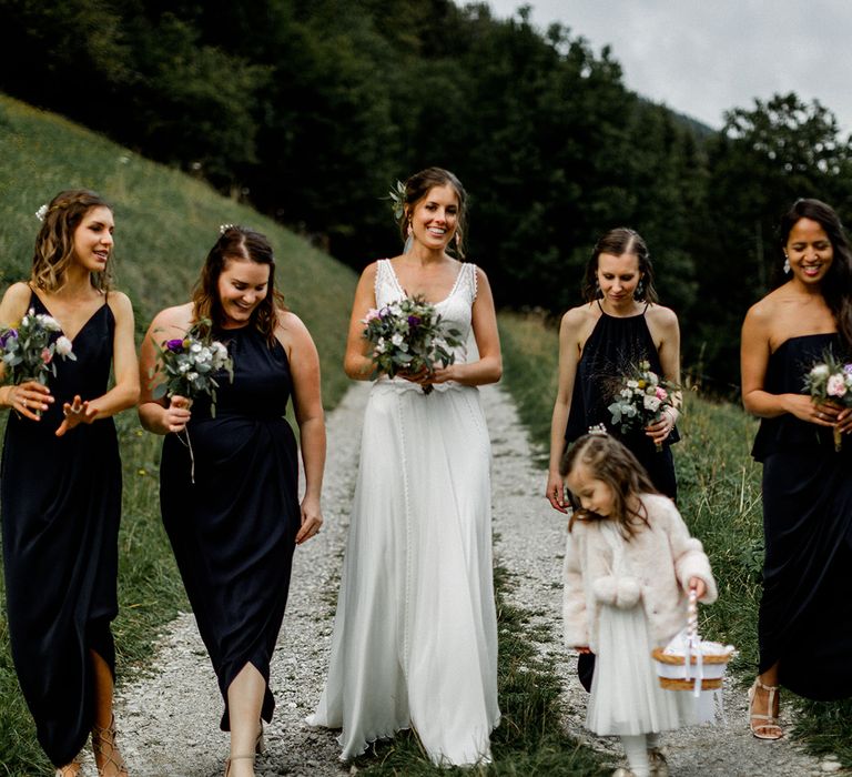 Bridal Party Picture in the French Alps with Bride in Mariées Passion Wedding Dress and Bridesmaids in Navy Dresses