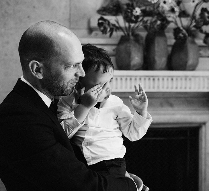 Groom in Black Reiss Jacket and Black Nudie Jeans with Church's Shoes | Page Boy in Zara Shirt, Trousers and Bow Tie | High Street Wedding Dress for an Intimate Crouch End Pub Wedding with Bright Flowers | Miss Gen Photography