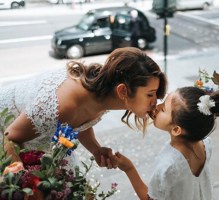 Bride in Lace Whistles Wedding Dress with High/Low Hem and Bardot Neckline | Flower Girl in White Zara Dress with Short Sleeves and Scoop Back | Wedding Bouquets with Bright Wild Flowers | High Street Wedding Dress for an Intimate Crouch End Pub Wedding with Bright Flowers | Miss Gen Photography