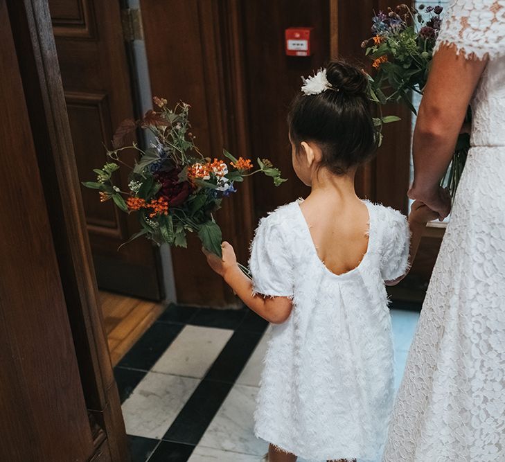 Bride in Lace Whistles Wedding Dress with High/Low Hem and Bardot Neckline | Flower Girl in White Zara Dress with Short Sleeves and Scoop Back | Wedding Bouquets with Bright Wild Flowers | High Street Wedding Dress for an Intimate Crouch End Pub Wedding with Bright Flowers | Miss Gen Photography