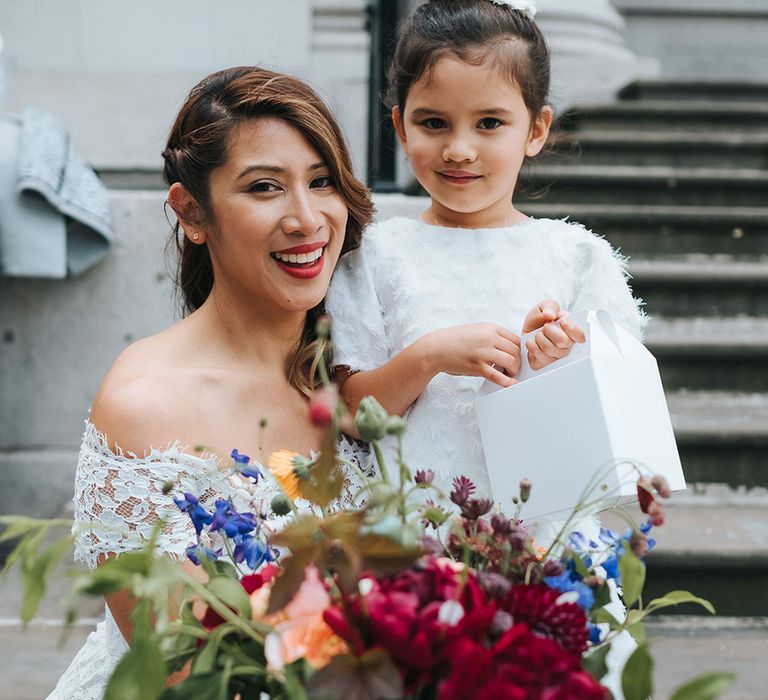 Bride in Lace Whistles Wedding Dress with High/Low Hem and Bardot Neckline | Flower Girl in White Zara Dress with Short Sleeves and Scoop Back | Bridal Bouquet with Bright Wild Flowers | High Street Wedding Dress for an Intimate Crouch End Pub Wedding with Bright Flowers | Miss Gen Photography