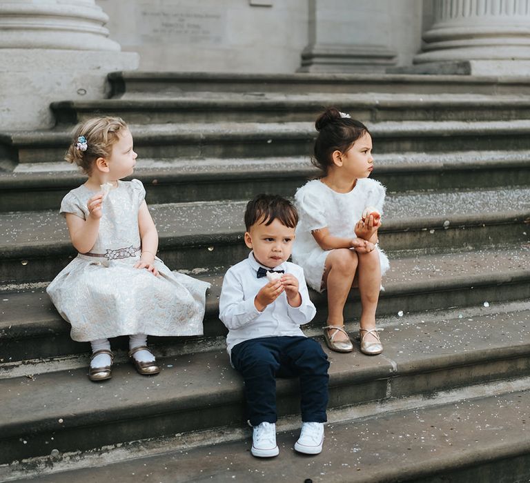 Flower Girl in White Zara Dress with Short Sleeves and Scoop Back | Page Boy in Zara Shirt, Trousers and Bow Tie | Wedding Ceremony at Old Marylebone Town Hall | High Street Wedding Dress for an Intimate Crouch End Pub Wedding with Bright Flowers | Miss Gen Photography