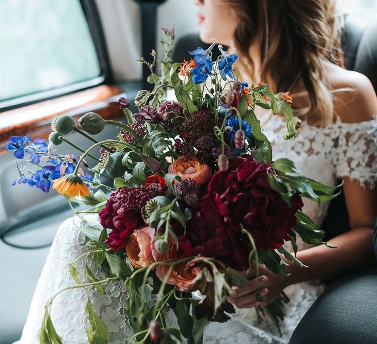 Bride in Lace Whistles Wedding Dress with High/Low Hem and Bardot Neckline | Bridal Bouquet with Bright Wild Flowers | High Street Wedding Dress for an Intimate Crouch End Pub Wedding with Bright Flowers | Miss Gen Photography