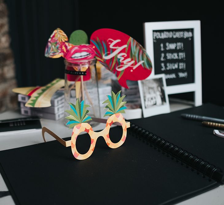 Polaroid Photobooth with Props and Guestbook | Victoria Stakes Pub Wedding Reception | High Street Wedding Dress for an Intimate Crouch End Pub Wedding with Bright Flowers | Miss Gen Photography