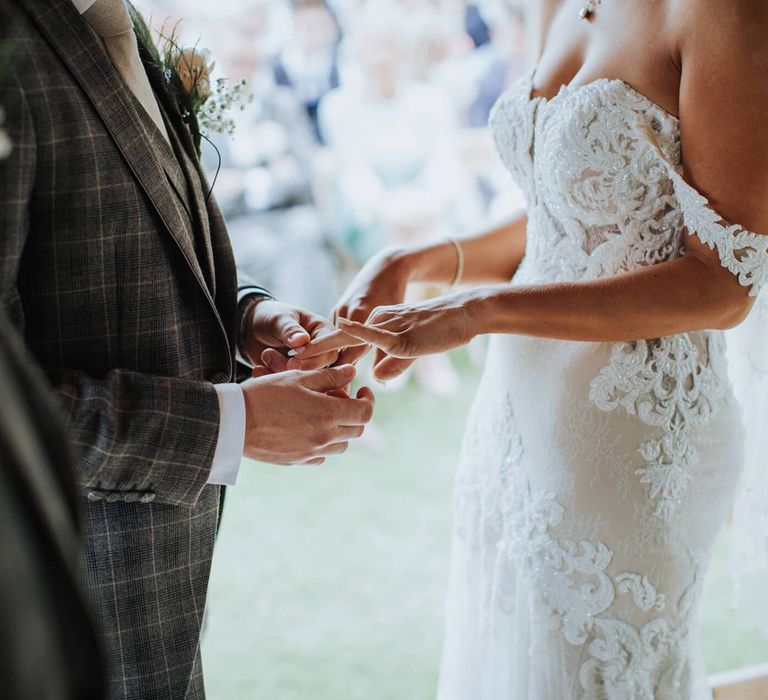 Bride and Groom Exchange Rings During Ceremony