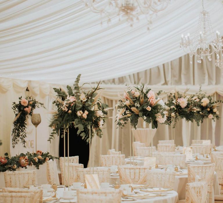 Beautiful Blush Wedding Table Set Up In Marquee With Floral Backdrop