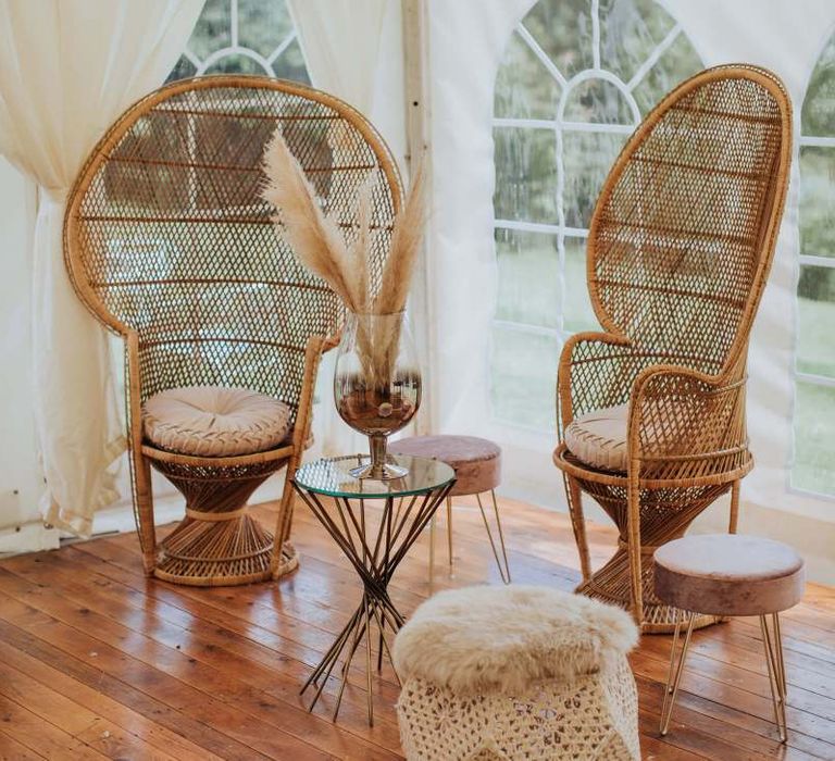 Peacock Chairs and Pampas Grass at Wedding With Floral Backdrop