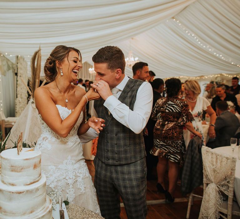 Bride and Groom Cut The Wedding Cake