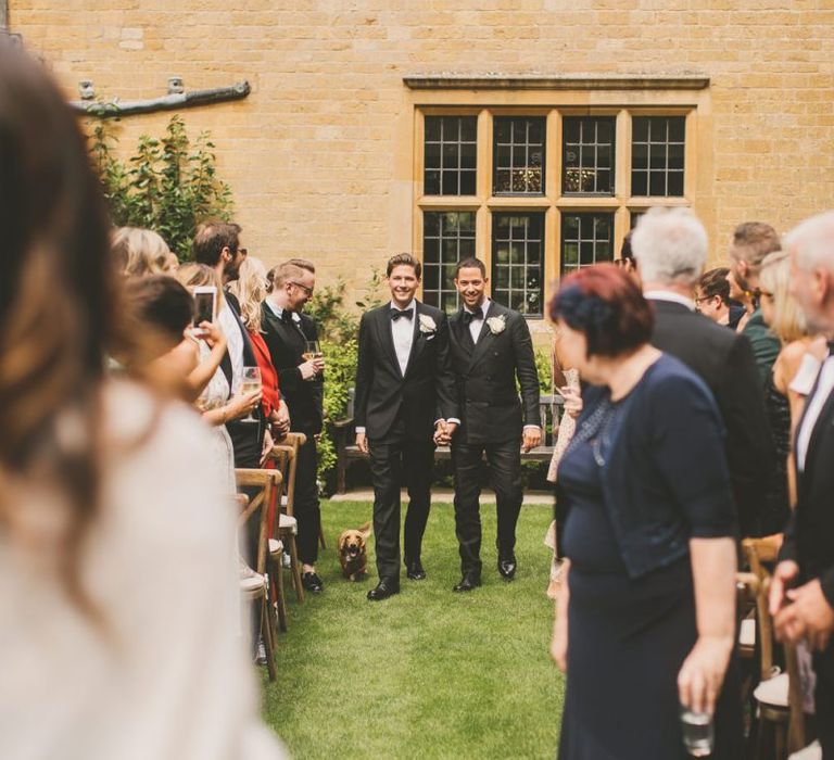 Two Grooms and Pet Long-Haired Dachshund Walking Down The Aisle Together