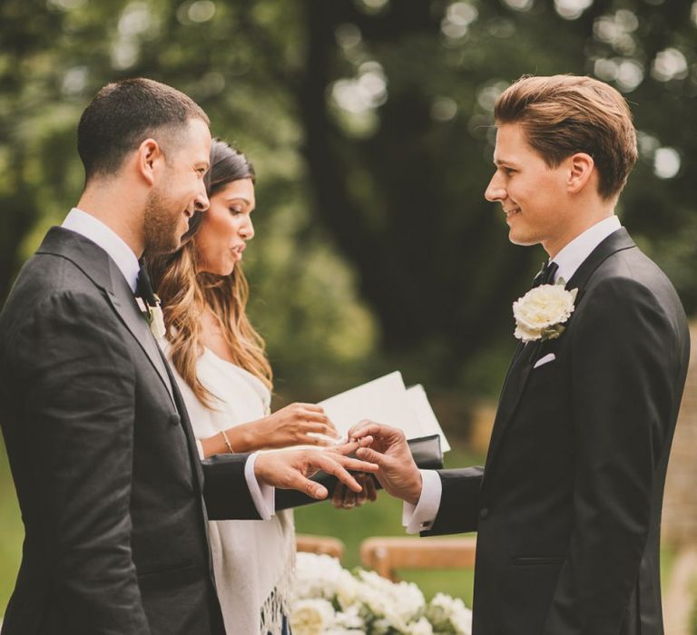 Groom and Groom Exchanging Rings  at Worcestershire Wedding Venue Foxhill Manor