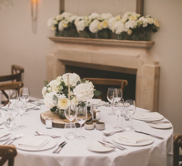 White Flower Centrepiece and Fireplace Flowers with Hydrangeas and Roses at Worcestershire Wedding Venue