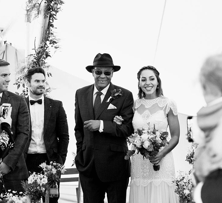 Entrance of the Bride | Laced KatyaKatya Wedding Dress with Cap Sleeves and Ribbon Belt | Floor Length Veil | Bridal Bouquet of Wild Flowers  with Lavender, Thistles, White Roses and Eucalyptus | Lace KatyaKatya Dress for Tipi Wedding at Fforest Farm | Claudia Rose Carter Photography