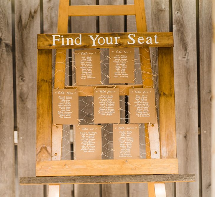 Wedding Reception Decor | Seating Plan | Lace KatyaKatya Dress for Tipi Wedding at Fforest Farm | Claudia Rose Carter Photography