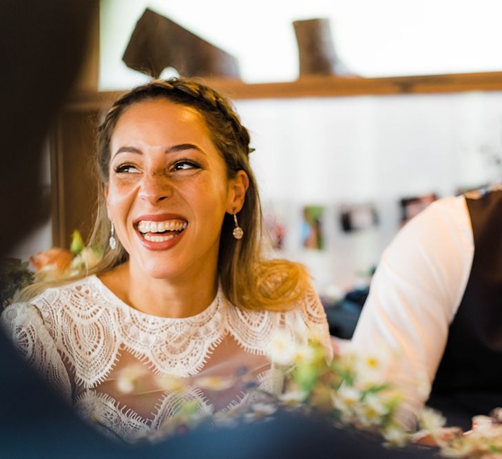 Bride in Laced KatyaKatya Wedding Dress with Cap Sleeves and Ribbon Belt | Groom in Blue T.M Lewin Suit with Navy Hawkes Bespoke Outfitters Waistcoat | Lace KatyaKatya Dress for Tipi Wedding at Fforest Farm | Claudia Rose Carter Photography